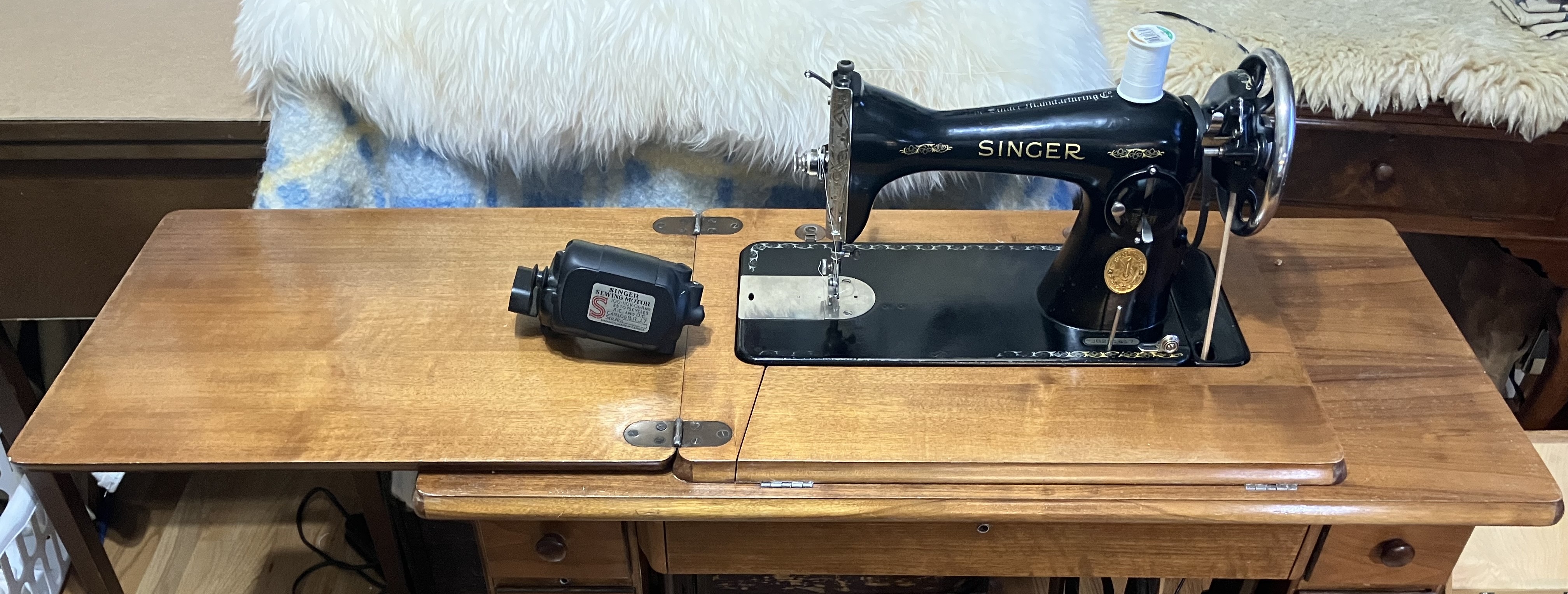 Antique Singer sewing machine in cabinet